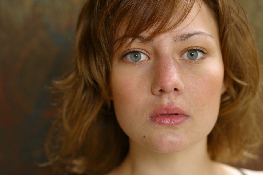 A woman with a blank facial expression