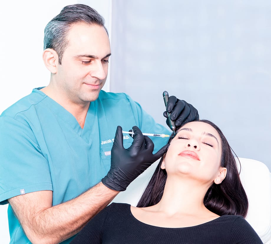 Dr. Sedgh injecting Botox into client's face