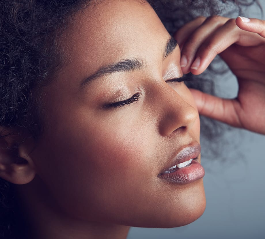 Woman with her head tilted up and eyes closed