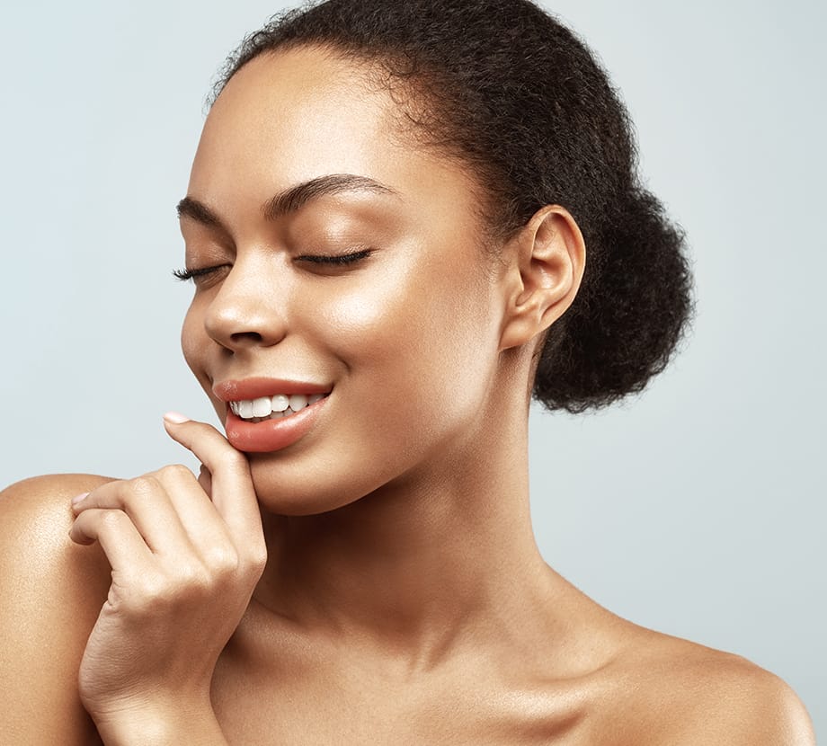 Woman leaning her hand against her chin with her eyes closed