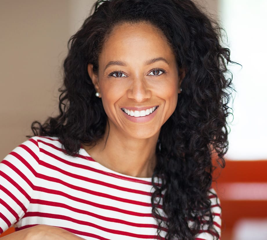 Woman wearing a shirt that has red and white stripes