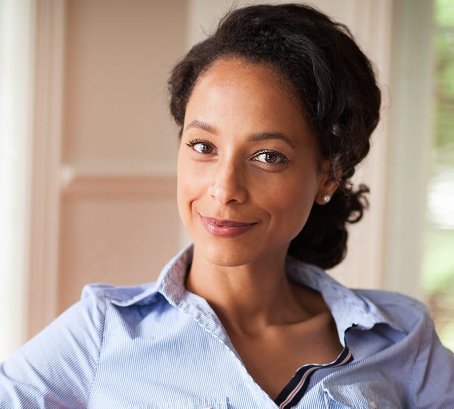 Woman that has her hair back while sitting in a chair