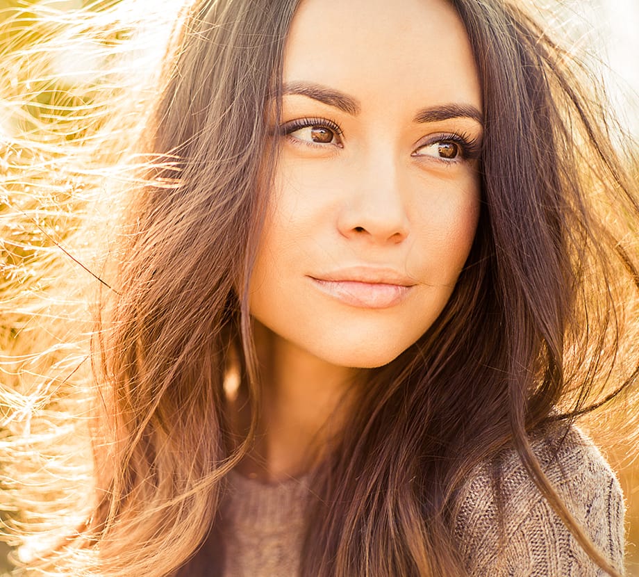 Woman looking to the side while outside