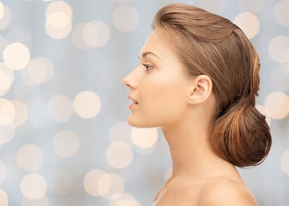 Beautiful young woman face over blue background